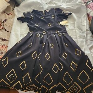 Chic Black Dress with Gold Geometric Design